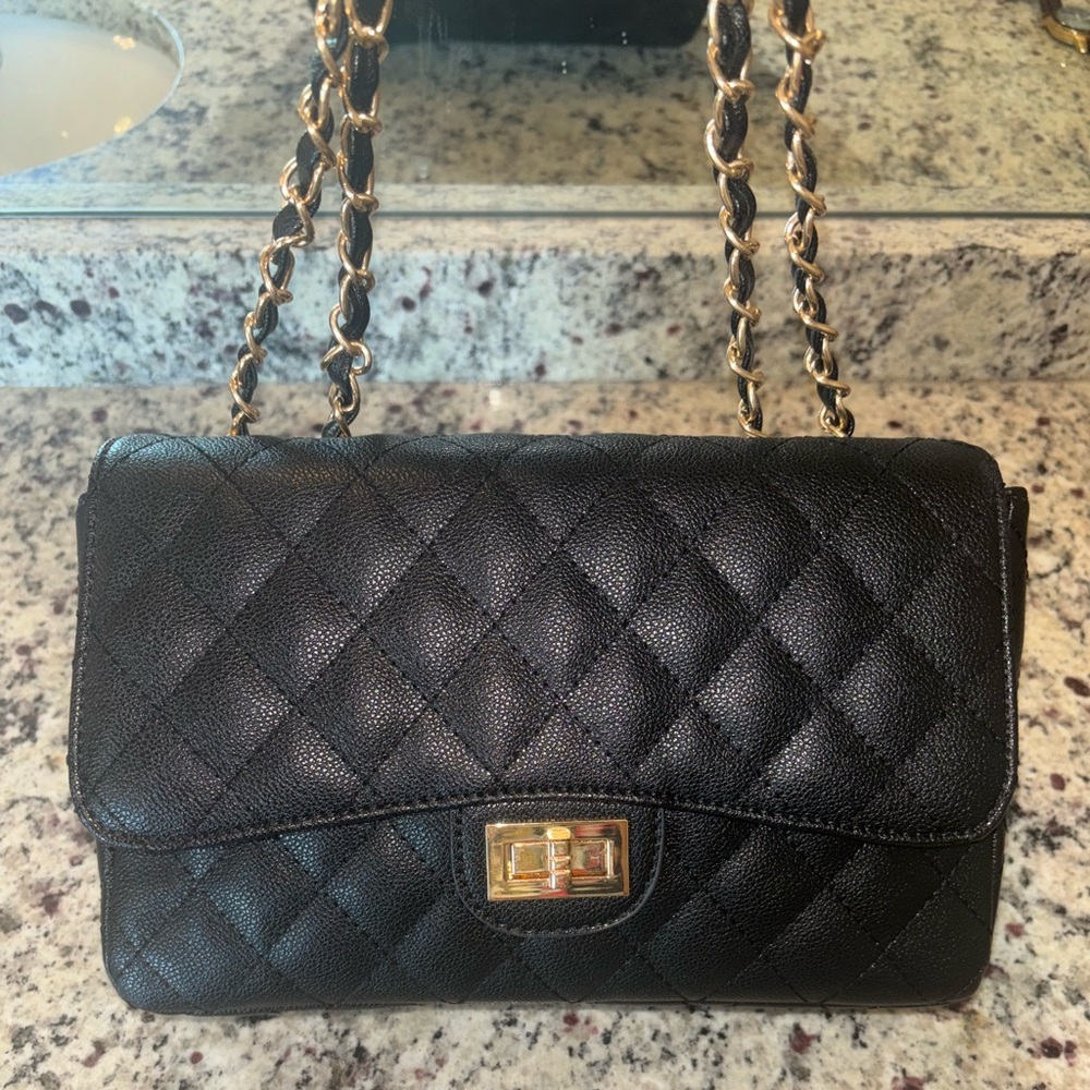 Black quilted purse with gold chain straps